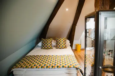 Un ou plusieurs lits dans un hébergement de l'établissement Chambres d'hôte - Maison des écrivains - 50 m de la cathédrale et place des jacobins