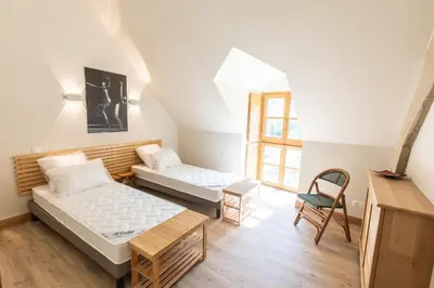 Un ou plusieurs lits dans un hébergement de l'établissement Château de Conon - Gîte l'Orangerie