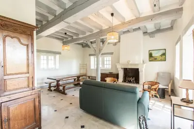 Coin salon dans l'établissement Château de Conon - Gîte la Bergerie