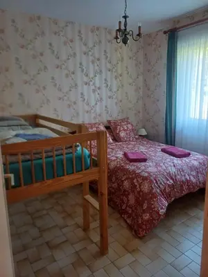 Un ou plusieurs lits dans un hébergement de l'établissement Gîte Bô