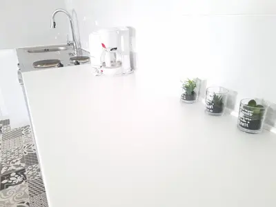 Cuisine ou kitchenette dans l'établissement Appartement, proche Gare et Centre-Ville