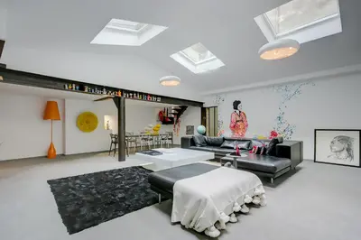 Un ou plusieurs lits dans un hébergement de l'établissement Logement atypique 200m2 au Calme et Confort
