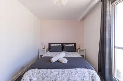 Un ou plusieurs lits dans un hébergement de l'établissement Appartement Hyper Centre Parking Privée