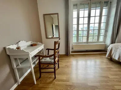 Un ou plusieurs lits dans un hébergement de l'établissement La Place du Château - Vue exceptionnelle sur le château de Blois