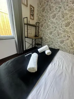 Un ou plusieurs lits dans un hébergement de l'établissement Le cosy charmeur Climatisé avec patio