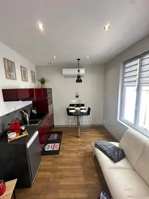 Coin salon dans l'établissement Le cosy charmeur Climatisé avec patio