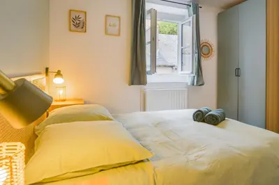 Un ou plusieurs lits dans un hébergement de l'établissement Maison avec spa dans l'hypercentre de Blois