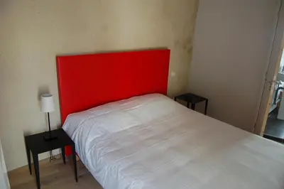 Un ou plusieurs lits dans un hébergement de l'établissement Rocaminori Hôtel
