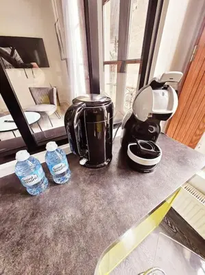 Cuisine ou kitchenette dans l'établissement appartement calme, centre-ville