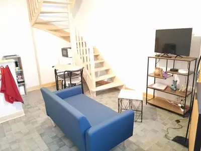 Télévision ou salle de divertissement dans l'établissement Maisons du château