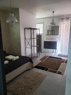 Un ou plusieurs lits dans un hébergement de l'établissement Maisonnette au coeur du circuit des 24h du Mans
