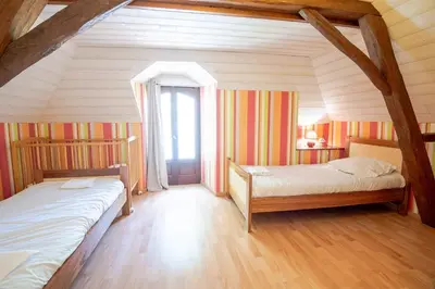 Un ou plusieurs lits dans un hébergement de l'établissement La petite maison sur la colline
