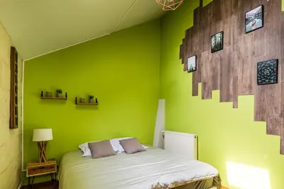 Un ou plusieurs lits dans un hébergement de l'établissement Charme & Calme 2 chambres centre Saumur