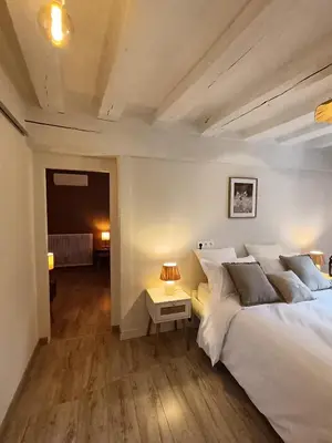 Un ou plusieurs lits dans un hébergement de l'établissement LE JARDIN DE LA PICHONNERIE Chambres d'hôtes