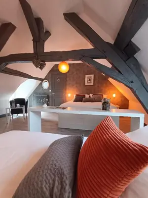 Un ou plusieurs lits dans un hébergement de l'établissement LE JARDIN DE LA PICHONNERIE Chambres d'hôtes