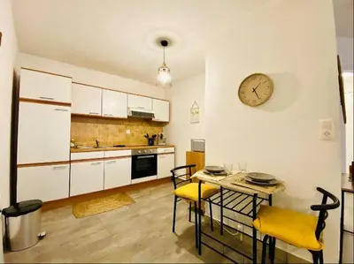 Cuisine ou kitchenette dans l'établissement Appartement Centre-Ville - 3 Voyageurs