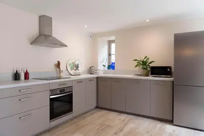 Cuisine ou kitchenette dans l'établissement Le Petit Munet