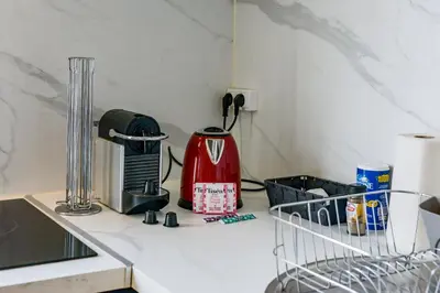 Cuisine ou kitchenette dans l'établissement Le Paradis D'Oé - Hypercentre - Netflix