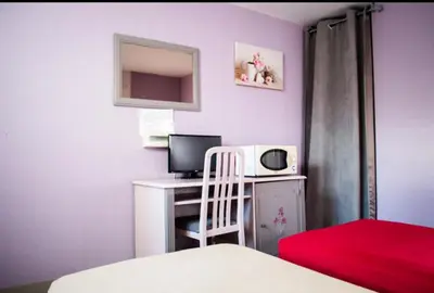 Un ou plusieurs lits dans un hébergement de l'établissement Le relais du chapeau rouge