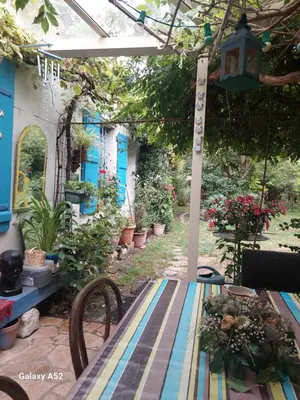 Jardin de l'établissement Chambres dans longère particulière