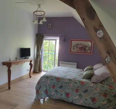 Un ou plusieurs lits dans un hébergement de l'établissement Le Logis Ronsard - Gîte de charme en Touraine