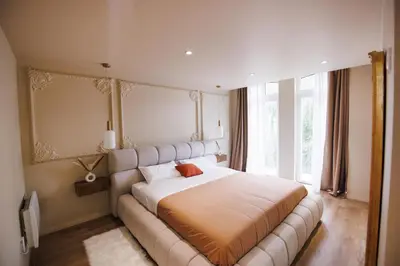 Un ou plusieurs lits dans un hébergement de l'établissement Eden Room - Luxe, Balnéo & Sauna