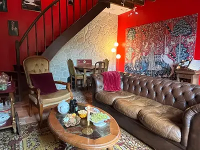 Coin salon dans l'établissement La maison sur demande - Harry Potter - Ciné Room