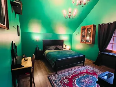 Un ou plusieurs lits dans un hébergement de l'établissement La maison sur demande - Harry Potter - Ciné Room