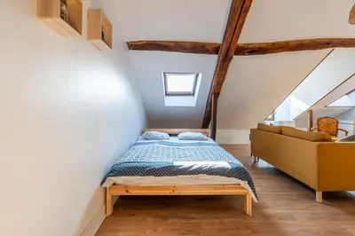Un ou plusieurs lits dans un hébergement de l'établissement Le cocon - Appartement en hyper centre
