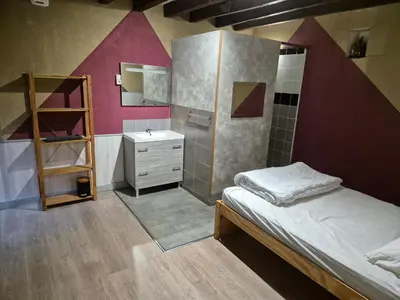 Un ou plusieurs lits dans un hébergement de l'établissement Les Cottages de Charme