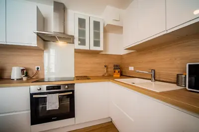 Cuisine ou kitchenette dans l'établissement La Pause Tourangelle - Calme - Wifi - Parking