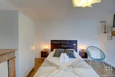 Un ou plusieurs lits dans un hébergement de l'établissement Grand Appartement - Proche Bord de Loire - Wifi