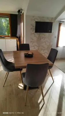 Télévision ou salle de divertissement dans l'établissement Le chalet de l'amitié