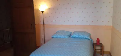 Un ou plusieurs lits dans un hébergement de l'établissement La maison paisible au village