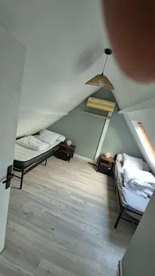 Un ou plusieurs lits dans un hébergement de l'établissement Charmante maison près des bords de la Loire
