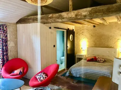 Un ou plusieurs lits dans un hébergement de l'établissement Le Petit Clos d'Anjou avec Bain nordique et sauna
