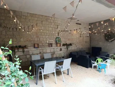 Coin salon dans l'établissement Le Petit Domaine - Centre Ville