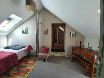 Un ou plusieurs lits dans un hébergement de l'établissement Maison de charme