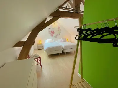 Un ou plusieurs lits dans un hébergement de l'établissement Gîte familial spacieux près de Villandry, avec jardin, pétanque et WIFI - FR-1-381-595
