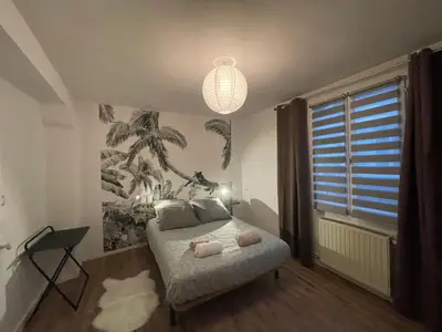 Un ou plusieurs lits dans un hébergement de l'établissement Jolie Maison de Ville