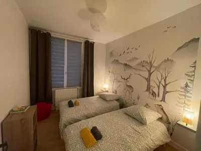 Un ou plusieurs lits dans un hébergement de l'établissement Jolie Maison de Ville