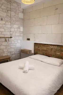 Un ou plusieurs lits dans un hébergement de l'établissement Studio Lumière - Pause lumineuse à 5 min du Zoo