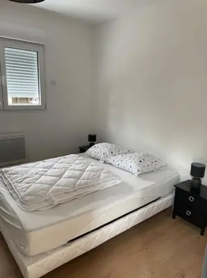 Un ou plusieurs lits dans un hébergement de l'établissement Les Chalets du Mancel Chalet Maïka -Bouleries Jump - 24h du Mans