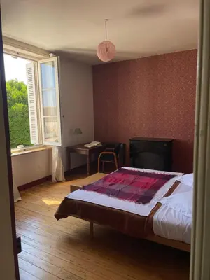 Un ou plusieurs lits dans un hébergement de l'établissement Manoir de La Galotière