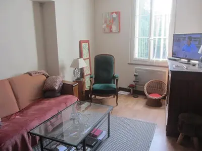 Coin salon dans l'établissement Chez Annie Chambre chez l'habitant