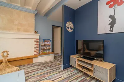 Télévision ou salle de divertissement dans l'établissement Gite Le Charme