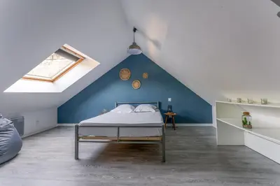 Un ou plusieurs lits dans un hébergement de l'établissement Maison centre Bourgueil avec piscine 8 p