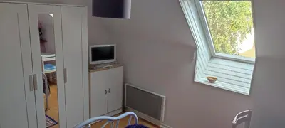 Télévision ou salle de divertissement dans l'établissement Chambre en maison chez l habitant