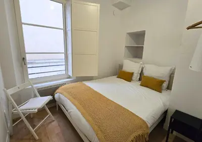 Un ou plusieurs lits dans un hébergement de l'établissement L'Expérience Tourangelle #3