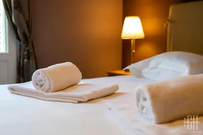 Un ou plusieurs lits dans un hébergement de l'établissement Appartement familial 2 chambres, 2 salles de bains